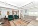 Spacious living room with comfortable seating, coffered ceiling, and seamless flow into the dining and kitchen areas at 764 E 42Nd St, Indianapolis, IN 46205