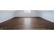 Bright bedroom showcasing hardwood floors, a window, and neutral paint at 832 N Parker Ave, Indianapolis, IN 46201