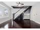 Foyer features refinished hardwood floors, staircase and great light at 832 N Parker Ave, Indianapolis, IN 46201