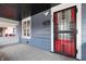 Covered front porch features a decorative security door and view to side yard at 832 N Parker Ave, Indianapolis, IN 46201