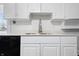 Kitchen featuring white cabinetry, stainless steel appliances and a deep farmhouse sink at 832 N Parker Ave, Indianapolis, IN 46201