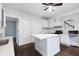 Bright kitchen features updated cabinets, stainless steel appliances, and a marble-topped center island at 832 N Parker Ave, Indianapolis, IN 46201