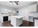 Bright kitchen features updated cabinets, stainless steel appliances, and a marble-topped center island at 832 N Parker Ave, Indianapolis, IN 46201