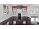 Spacious living room featuring hardwood floors, a fireplace, and large windows at 832 N Parker Ave, Indianapolis, IN 46201
