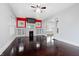 Spacious living room featuring hardwood floors, a fireplace, and large windows at 832 N Parker Ave, Indianapolis, IN 46201
