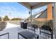 Covered patio with outdoor seating, grill, and snow-covered furniture in the fenced backyard space at 9046 Pinecreek Ct, Indianapolis, IN 46256