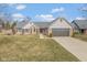 Charming single-Gathering home featuring a brick facade, well-kept lawn, and a two-car attached garage at 9046 Pinecreek Ct, Indianapolis, IN 46256