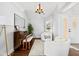 Bright, airy living room featuring modern furnishings, hardwood floors, and a large window for natural light at 9046 Pinecreek Ct, Indianapolis, IN 46256