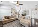 Spacious open-concept living room with hardwood floors, plush sectional sofa, and contemporary decor at 9046 Pinecreek Ct, Indianapolis, IN 46256