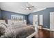 Comfortable main bedroom with a vaulted ceiling, window seat, and an ensuite bathroom at 9046 Pinecreek Ct, Indianapolis, IN 46256