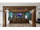 Stylish bar with a rustic wooden frame, a tiled backsplash, and seating for residents and guests at 9748 Junction Station, Fishers, IN 46037