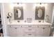 Bathroom featuring double sinks, vanity, and decorative mirrors, and luxury finishes at 9748 Junction Station, Fishers, IN 46037