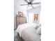 Bright bedroom featuring a dresser, decorations, ceiling fan, and grey accents at 9748 Junction Station, Fishers, IN 46037