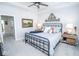 Stylish bedroom featuring a wrought iron bed frame, ceiling fan, and neutral decor at 9748 Junction Station, Fishers, IN 46037