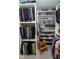 Walk-in closet featuring custom shelving and clothing racks with ample storage at 9748 Junction Station, Fishers, IN 46037