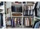 Walk-in closet with custom shelving and multiple racks for ample storage at 9748 Junction Station, Fishers, IN 46037