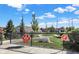 Community dog park area with paw print signs, a bone-shaped feature, and green space at 9748 Junction Station, Fishers, IN 46037