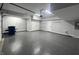 Large garage featuring epoxy flooring, ample lighting, and plenty of room for parking and storage at 9748 Junction Station, Fishers, IN 46037