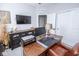 Well-lit home office with a wood desk, leather chair, and ample storage space at 9748 Junction Station, Fishers, IN 46037