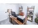 Home office with wood desk, leather chair, shelving, and neutral decor at 9748 Junction Station, Fishers, IN 46037
