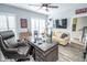 Inviting home office with a large desk, comfortable seating, and a view of the staircase at 9748 Junction Station, Fishers, IN 46037
