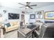 Stylish home office with a comfortable seating area and decorative sports memorabilia on display at 9748 Junction Station, Fishers, IN 46037