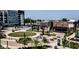 Outdoor seating area with a chess board, green space, trees, and nearby restaurants at 9748 Junction Station, Fishers, IN 46037
