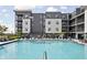 Inviting community pool with lounge chairs and well-maintained landscaping at apartment complex at 9748 Junction Station, Fishers, IN 46037