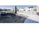 Spacious backyard with a privacy fence, patio, and lawn perfect for outdoor enjoyment in snowy conditions at 9858 Oakmont E Dr, Pendleton, IN 46064