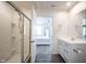 Bathroom with a glass shower and a modern vanity leading into the bedroom at 9858 Oakmont E Dr, Pendleton, IN 46064