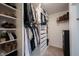 Walk-in closet with custom shelving for clothes, shoes, and accessories at 9858 Oakmont E Dr, Pendleton, IN 46064