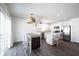 Bright kitchen open to the dining area, stainless steel appliances, white cabinetry, and natural light at 9858 Oakmont E Dr, Pendleton, IN 46064