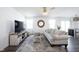 Cozy living room with a comfortable sofa, a stylish coffee table, and a large television at 9858 Oakmont E Dr, Pendleton, IN 46064