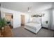 Bright main bedroom featuring carpet, fresh paint, modern furnishings and ensuite access at 9858 Oakmont E Dr, Pendleton, IN 46064