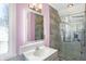 Stylish bathroom featuring a modern vanity with a sleek, lighted mirror and a glass-enclosed shower at 9970 Southwind Dr, Indianapolis, IN 46256