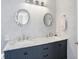 Elegant bathroom with a double sink vanity with marble countertop and decorative mirrors at 9970 Southwind Dr, Indianapolis, IN 46256