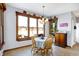 Charming breakfast nook featuring a wood table, natural light, and views of the outdoors at 9970 Southwind Dr, Indianapolis, IN 46256
