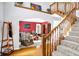 Inviting foyer featuring a grand staircase, open to the living area, and filled with natural light at 9970 Southwind Dr, Indianapolis, IN 46256