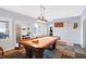 A finished game room with a pool table and custom shelving at 9970 Southwind Dr, Indianapolis, IN 46256