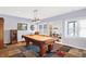 Spacious game room featuring a pool table, built-in shelving, and modern lighting at 9970 Southwind Dr, Indianapolis, IN 46256