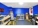 Bright garage with ample lighting, work bench, storage, and blue accent wall paint at 9970 Southwind Dr, Indianapolis, IN 46256