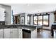 Bright kitchen featuring granite counters, white cabinets, and a sunlit eat-in area with backyard views at 9970 Southwind Dr, Indianapolis, IN 46256