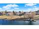 Scenic lake view with recreational boats, a dock, and homes lining the shore at 9970 Southwind Dr, Indianapolis, IN 46256