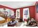Spacious living area with hardwood floors, bright windows, and an open archway to the foyer at 9970 Southwind Dr, Indianapolis, IN 46256