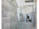 Modern shower with glass doors, dual shower heads, and unique, decorative shower wall niches at 9970 Southwind Dr, Indianapolis, IN 46256