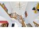 Open staircase area with natural light, leading to the upper levels and showcasing architectural design at 9970 Southwind Dr, Indianapolis, IN 46256