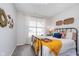 Comfortable bedroom with a metal bed frame, bright natural light, and tasteful decor for a relaxing atmosphere at 1051 Macoun Dr, Westfield, IN 46074