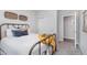 Comfortable bedroom with a metal bed frame, bright natural light, and tasteful decor for a relaxing atmosphere at 1051 Macoun Dr, Westfield, IN 46074