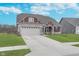 Charming home featuring a two-car garage, nicely manicured lawn, and stylish architectural details at 1051 Macoun Dr, Westfield, IN 46074