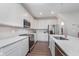Modern kitchen featuring white cabinetry, stainless steel appliances, and quartz countertops at 1051 Macoun Dr, Westfield, IN 46074